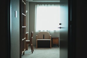 A room with a window, a chair, a small table, and a bookshelf. - someone, kyoto (Kyoto)