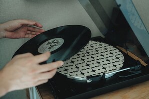 A vinyl record player with a record on it. - someone, kyoto (Kyoto)