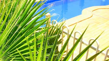 Outdoor pool, open 8:00 AM to 8:30 PM, pool loungers