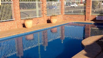 Outdoor pool, open 8:00 AM to 8:30 PM, pool loungers