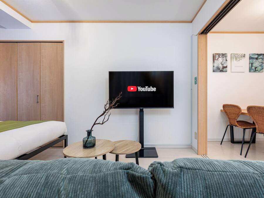 Deluxe-Apartment | Wohnbereich | Flachbildfernseher