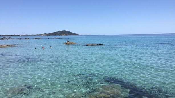 A clear coastal view with rocky formations and calm waters. - Base Camp Ogliastra - Flat Green  (Santa Maria Navarrese)