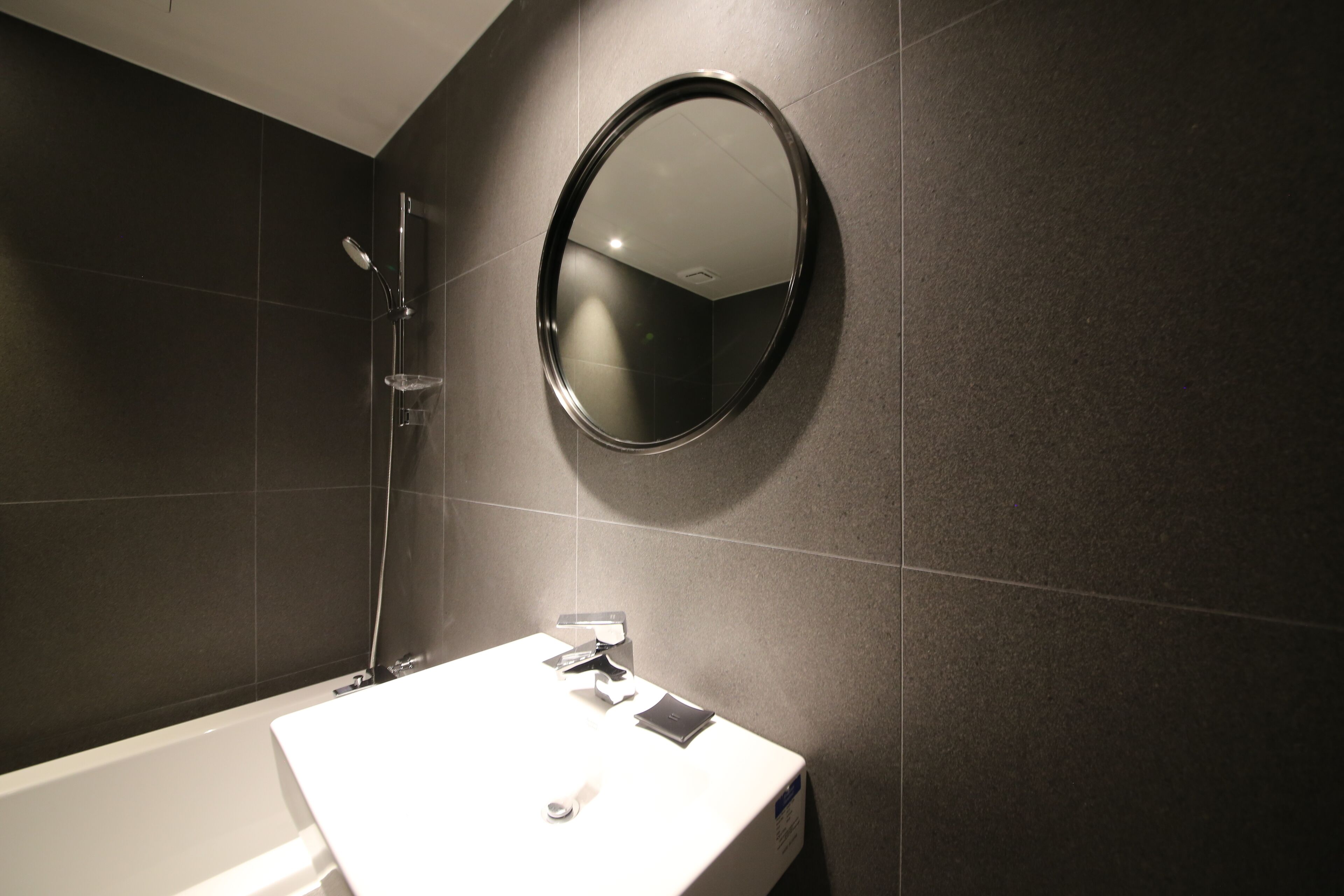 standard room | bathroom | hair dryer, slippers, towels, soap