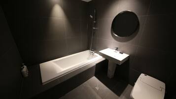 Deluxe Room | Bathroom | Hair dryer, slippers, towels, soap