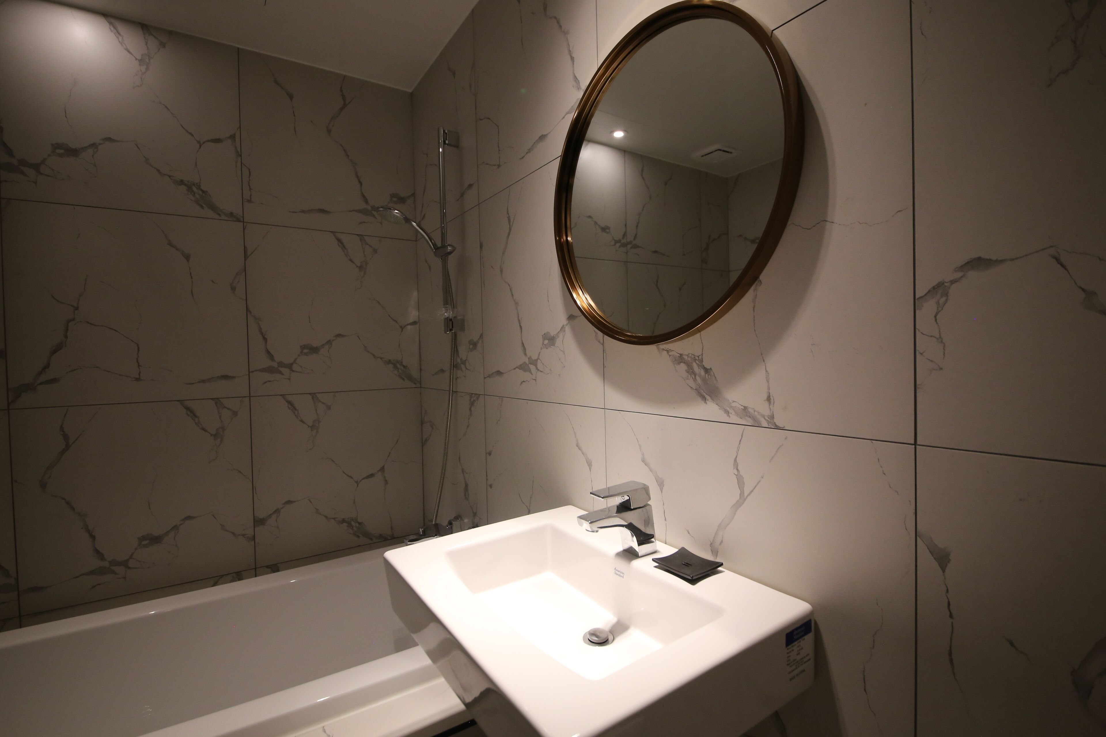 deluxe room | bathroom | hair dryer, slippers, towels, soap