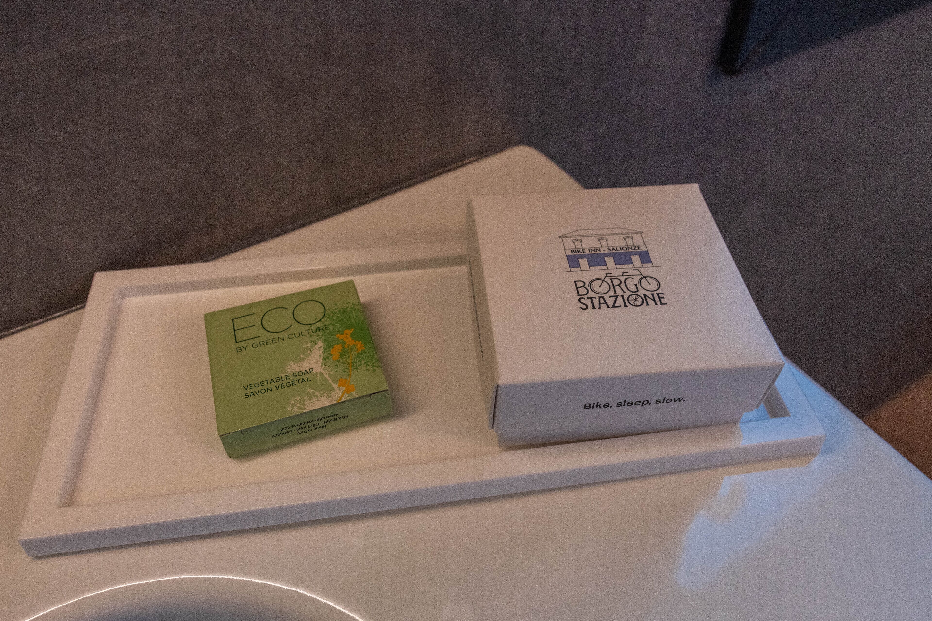 Two boxes on a white tray, one labeled 'ECO' and the other 'BORGOSTAZIONE'.