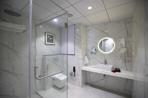 Deluxe Double Room | Bathroom | Shower, free toiletries, hair dryer, bathrobes - The Square Somnath (Veraval)