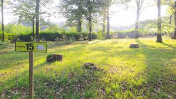 A camping area with a sign indicating a campsite number 15.