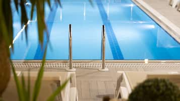 Seasonal outdoor pool, open 9:00 AM to 7:00 PM, pool umbrellas