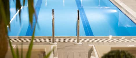 Seasonal outdoor pool, open 9:00 AM to 7:00 PM, pool umbrellas