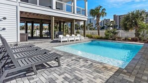 A two-story house with a swimming pool, outdoor seating, and a covered patio area. - 1 Fish 2 Fish🐟Private Pool Home👙Dogs OK🐶 (Okaloosa Island)