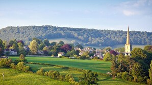 A rural landscape with a church spire, houses, and fields. - 1 bedroom accommodation in Todenham, near Moreton-in-Marsh (Todenham, near Moreton-in-Marsh)