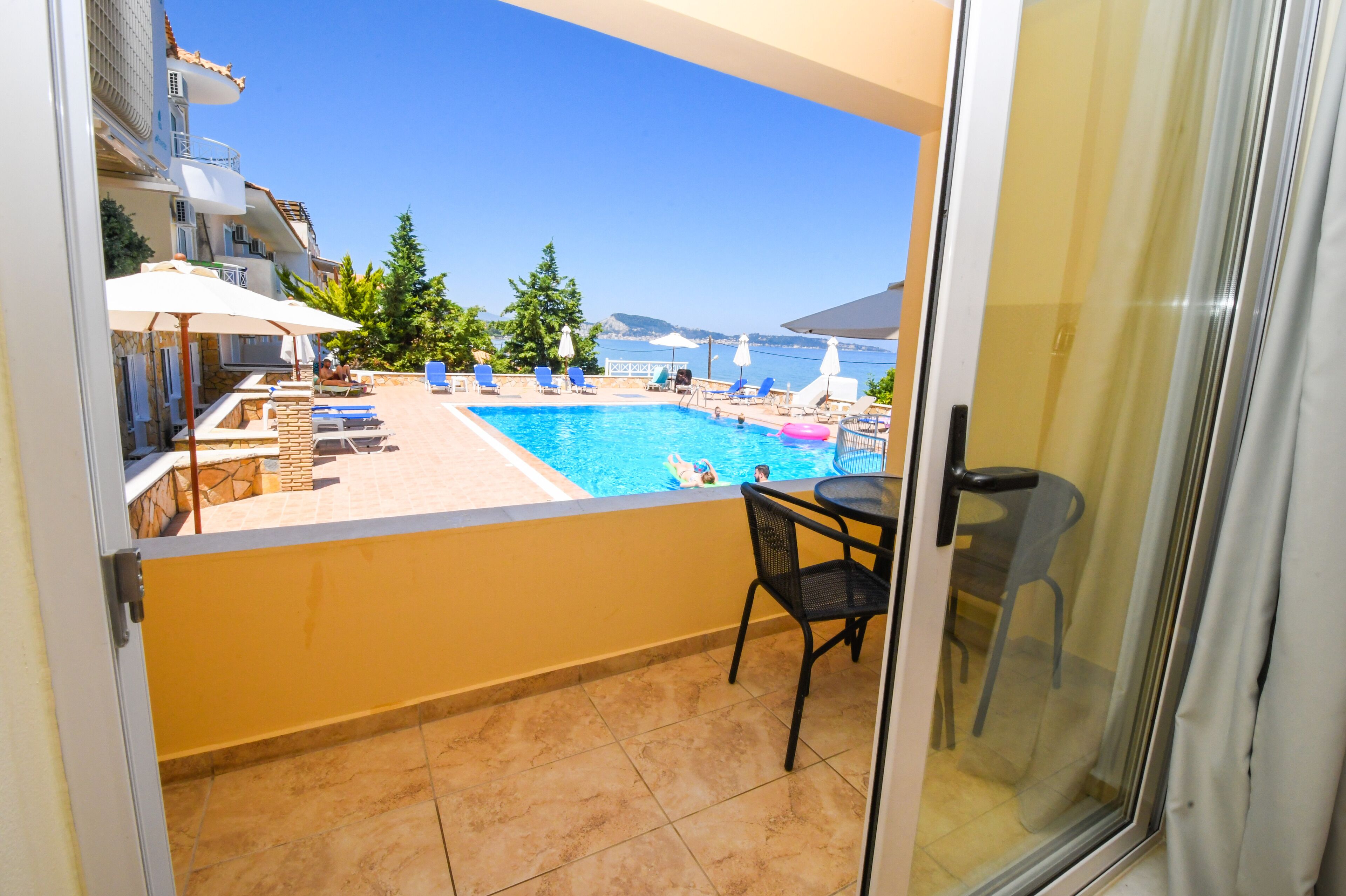 standard triple room, pool view | view from room