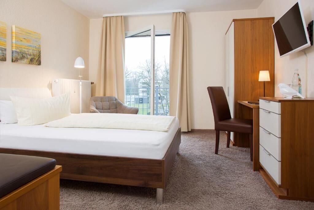 Desk, laptop workspace, blackout drapes, soundproofing