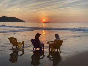 On the beach, sun-loungers, beach towels