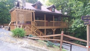 Enjoy the peaceful atmosphere of this cabin-style retreat with a spacious balcony and covered porch.