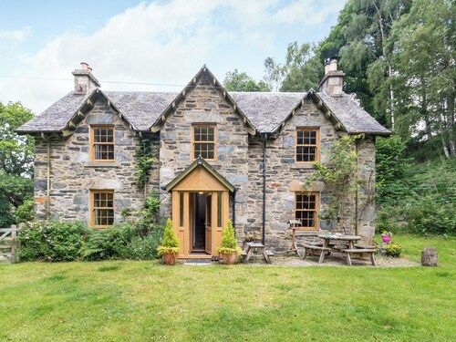 A beautiful former estate cottage, awash with character, nestling within its own ancient woodland.