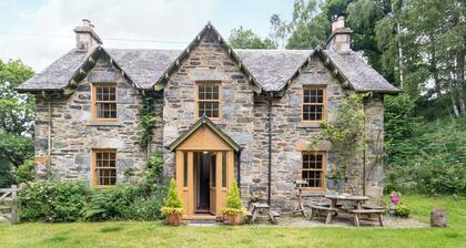 A beautiful former estate cottage, awash with character, nestling within its own ancient woodland.