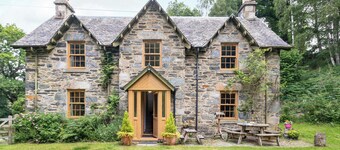 A beautiful former estate cottage, awash with character, nestling within its own ancient woodland.