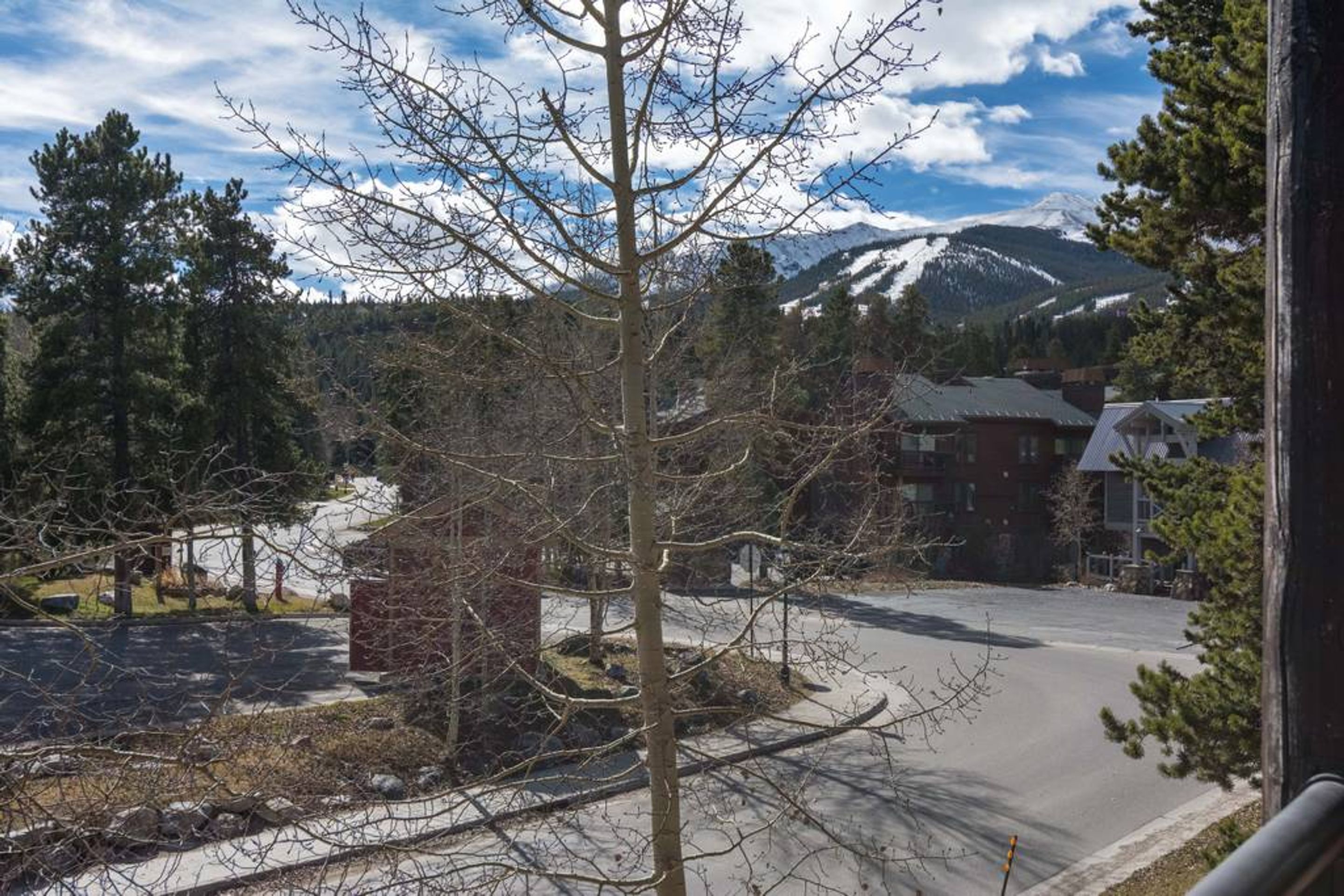 A residential area with a clear view of a mountain range in the background.