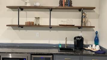 Fridge, microwave, coffee/tea maker, cookware/dishes/utensils