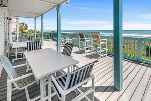 Outdoor dining - Stunning views at this large oceanfront home w/pool and game room ready for family fun! (North Myrtle Beach)