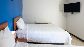 Standard Quadruple Room, 2 Queen Beds, Non Smoking, Refrigerator & Microwave | Desk, iron/ironing board, free WiFi, bed sheets