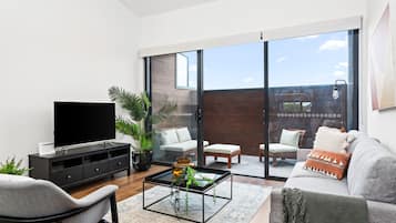 Three Bedroom Townhouse With Parking | Living area | LED TV