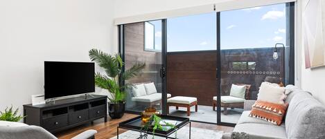 Three Bedroom Townhouse With Parking | Living area | LED TV