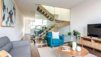 Three Bedroom Townhouse With Parking | Living area | LED TV