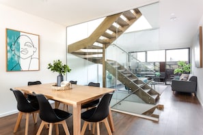 Three Bedroom Townhouse With Parking | Living area | LED TV - Little Grenfell Apartments by Urban Rest (Kent Town)