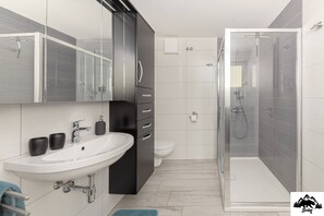 Hair dryer, slippers, towels, soap