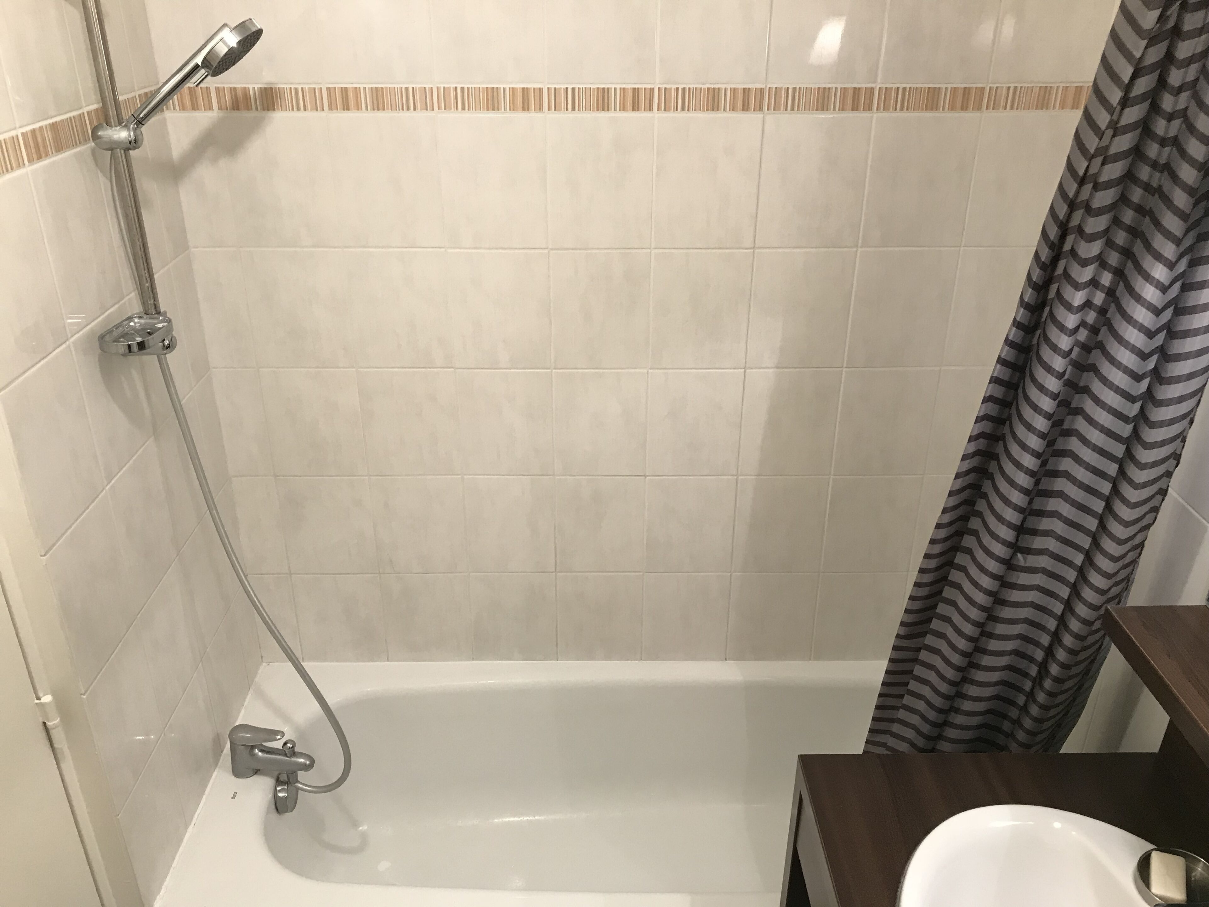 Bathtub, towels, soap, toilet paper