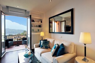 Honeymoon Apartment, Multiple Bedrooms (Brentano Elegante) | Living area | Flat-screen TV, heated floors