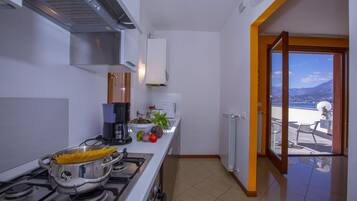Family Apartment, 2 Bedrooms (Fontana Del Lago Apt. 5) | Private kitchen | Fridge, microwave, oven, stovetop