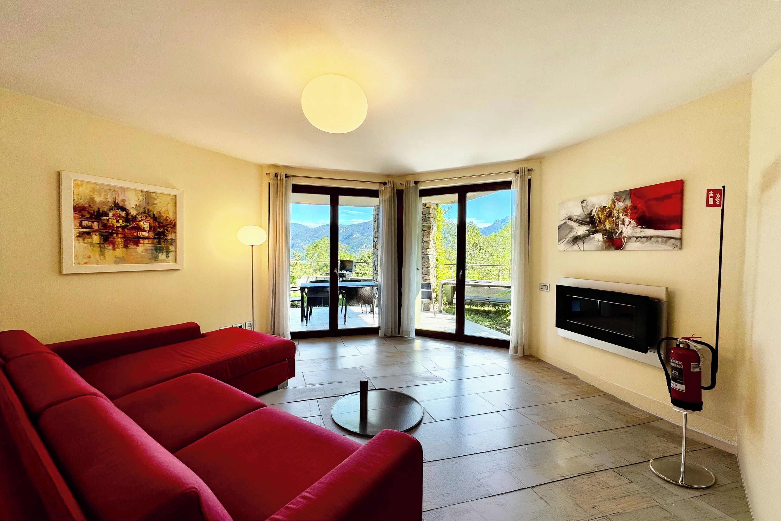 Honeymoon Apartment, Multiple Bedrooms, 2 Bathrooms, Mountainside (La Perla Di Sonenga - Giardino) | Living area | Flat-screen TV