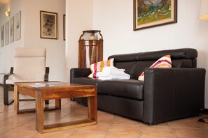 Family Apartment, Multiple Bedrooms, Mountainside (Alto Perledo Terrazzo) | Living area | Flat-screen TV