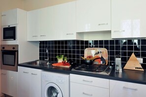 Family Apartment, Multiple Bedrooms, Mountainside (Villa Isella - Mansarda) | Private kitchen | Microwave, oven, stovetop, coffee/tea maker - Villa Isella - Mansarda (Carlazzo)