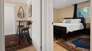 A room with a bed, bedside table, and a chair. - 2-BR Condo by Vail Resort: Outdoor Patio, Parking (Vail)