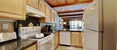 Condo, 2 Bedrooms | Private kitchen | Fridge, oven, coffee/tea maker, toaster