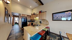 Condo, 4 Bedrooms | Private kitchen | Fridge, microwave, oven, dishwasher