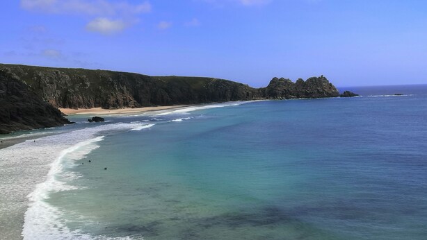 A coastal landscape with a sandy beach, clear turquoise waters, and rocky cliffs. - 1 Bed Cottage-sleeps 3-pool-pets-near St Ives (Camborne)