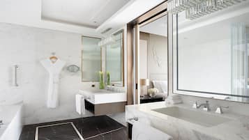 Separate bathtub and shower, free toiletries, hair dryer, bathrobes
