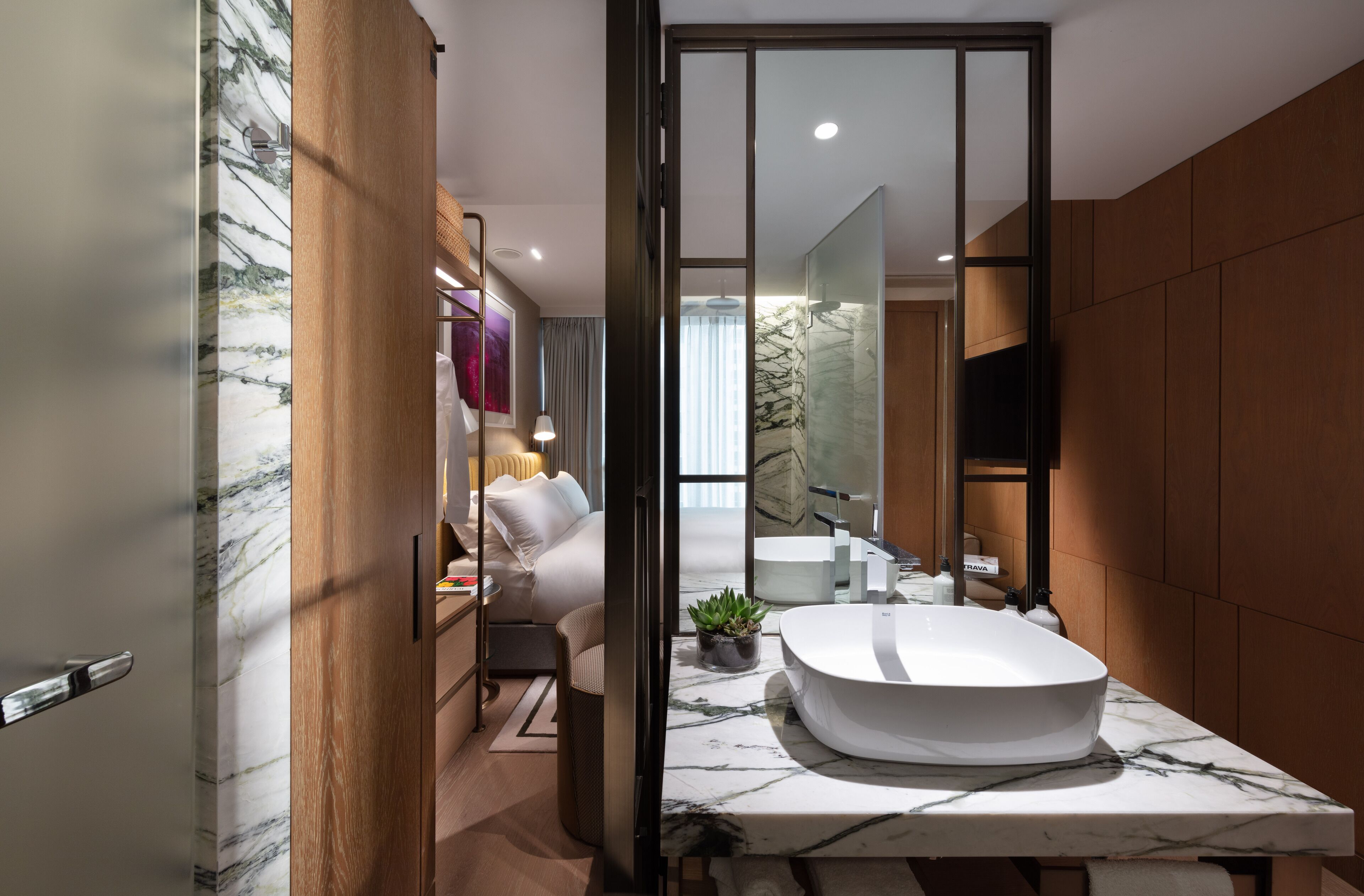 king room | bathroom | designer toiletries, hair dryer, bathrobes, slippers