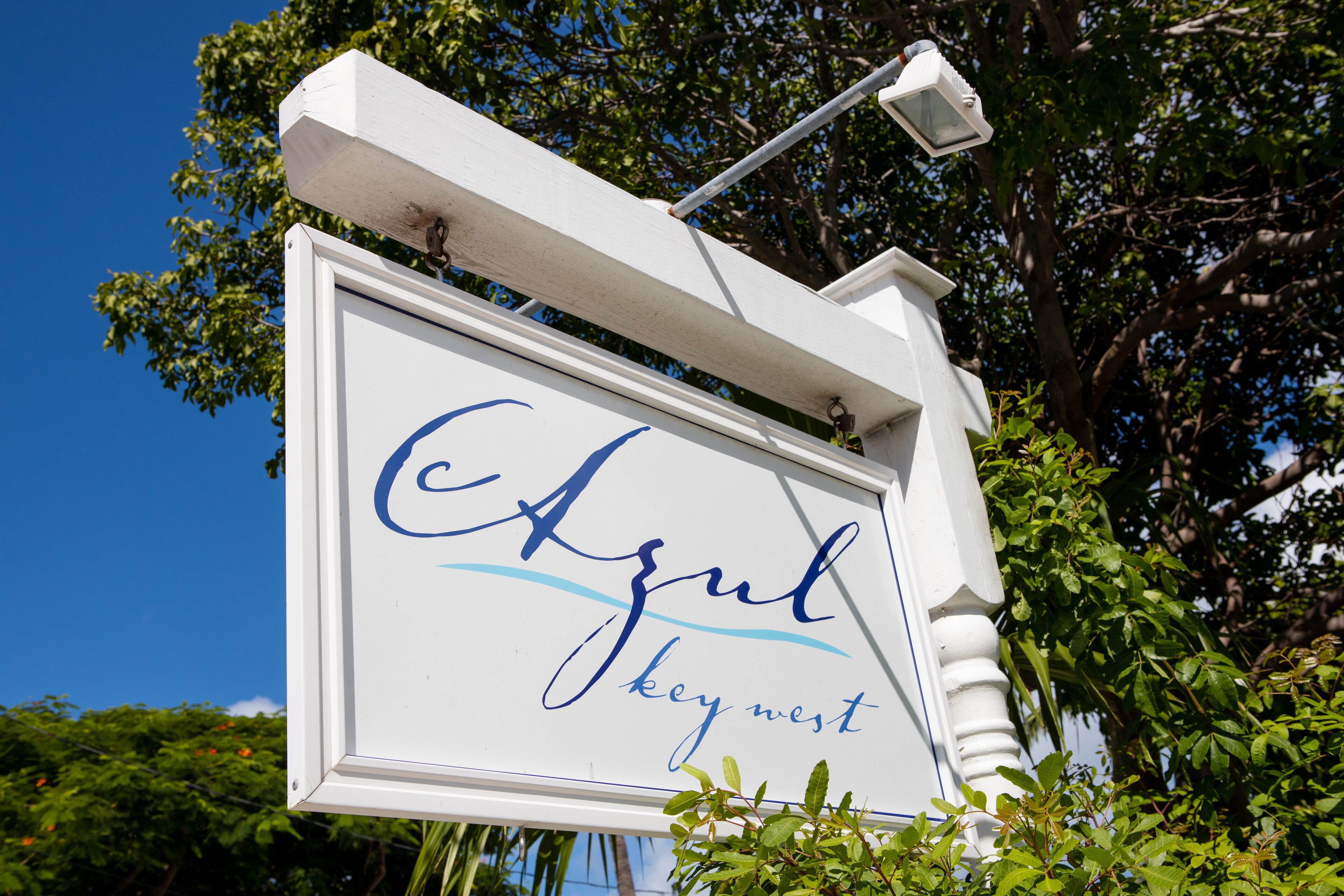 A sign with the name "Azul Key West" in blue cursive font.
