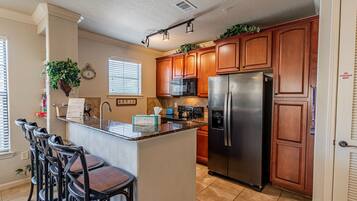 Condo, Multiple Beds, Patio, Garden View (Bella Piazza Condo) | Private kitchen | Fridge, microwave, stovetop, dishwasher
