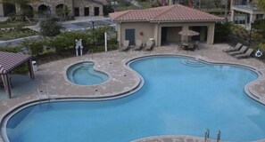 Relax by the central pool or unwind in the adjacent hot tub.