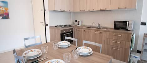 Apartment, 1 Bedroom | Private kitchen | Full-size fridge, microwave, oven, stovetop