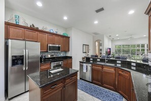 Fridge, microwave, oven, stovetop - Paseo - William Raveis Rentals (Fort Myers)