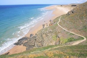 On the beach, sun-loungers